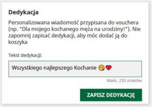 Dedication message form for voucher personalization with example text For my beloved husband on his birthday!. A text input field contains the message Wszystkiego najlepszego Kochanie 😊❤️ and below it, green button labeled ZAPISZ DEDYKACJĘ.